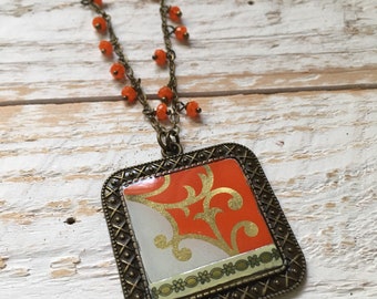 Orange, gold, and white vintage tin necklace