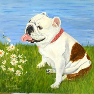 May include: A white and brown bulldog with a pink collar sits in a grassy field with white daisies. The dog is looking to the left of the image. The background is a blue lake with a city skyline in the distance.