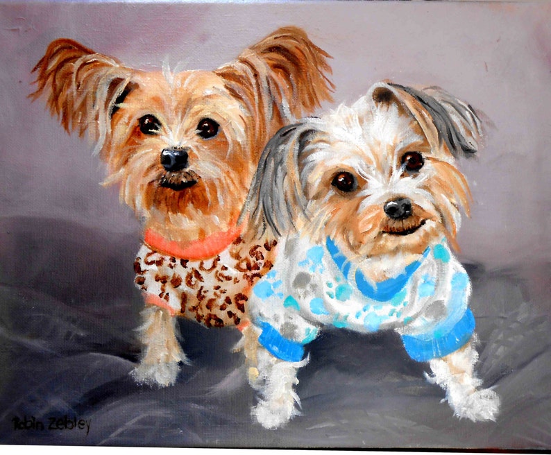 May include: Painting of two small, brown and white dogs wearing sweaters. The dog on the left is wearing a leopard print sweater with an orange collar. The dog on the right is wearing a blue and white sweater with paw prints. The dogs are sitting on a gray background.