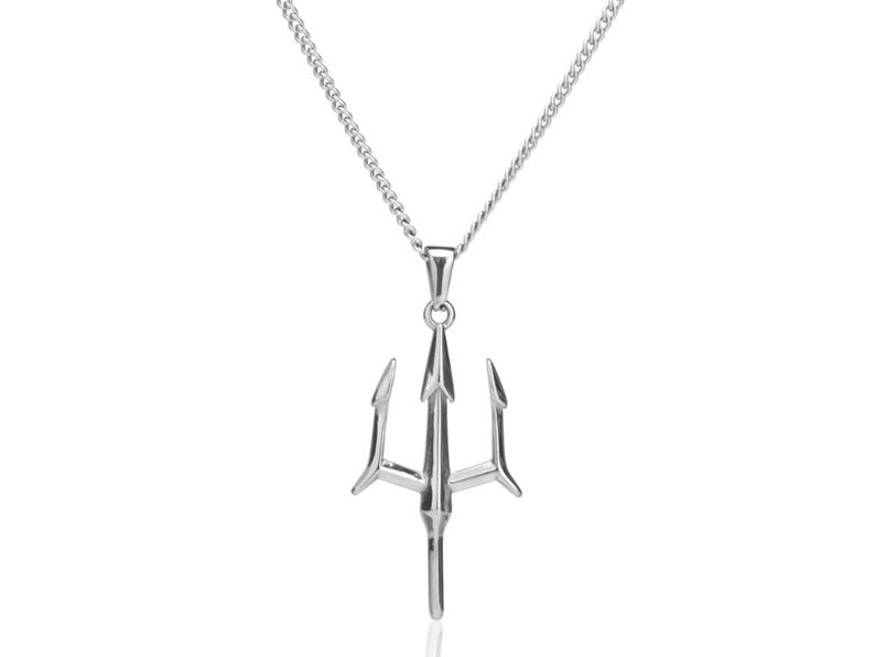 May include: A silver-toned metal necklace featuring a pendant shaped like a three-pronged trident. The pendant hangs from a delicate silver-colored curb chain. The trident design has a central point and two curved side prongs, all with a polished finish.