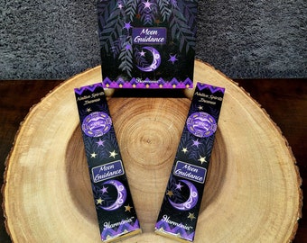 May include: Two packs of Native Spirits incense sticks with a purple, black, and gold design. The packaging features a crescent moon, stars, and the text "Moon Guidance" and "Harmonia".