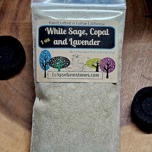 May include: A clear plastic bag containing 1 ounce of white sage, copal, and lavender incense blend. The bag has a label that reads "HandCrafted in Colfax California White Sage, Copal and Lavender 1 oz Not Intended For Internal Use EclipseGemstones.com".
