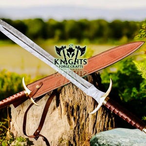 May include: Two crossed swords with ornate handles and blades, resting on a tree stump. The blades have a patterned design, and the handles are brown with gold accents. A brown leather sheath is visible. The image includes the text "KNIGHTS FORGE CRAFTS".