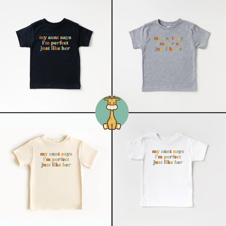 May include: Four toddler t-shirts with the text "my aunt says i'm perfect just like her" in rainbow colors. The shirts are in black, grey, white and beige.