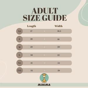 May include: A size chart for adult clothing with measurements in inches. The chart shows the length and width of different sizes, from XS to 2XL. The chart is on a beige background with a light green giraffe illustration at the bottom.