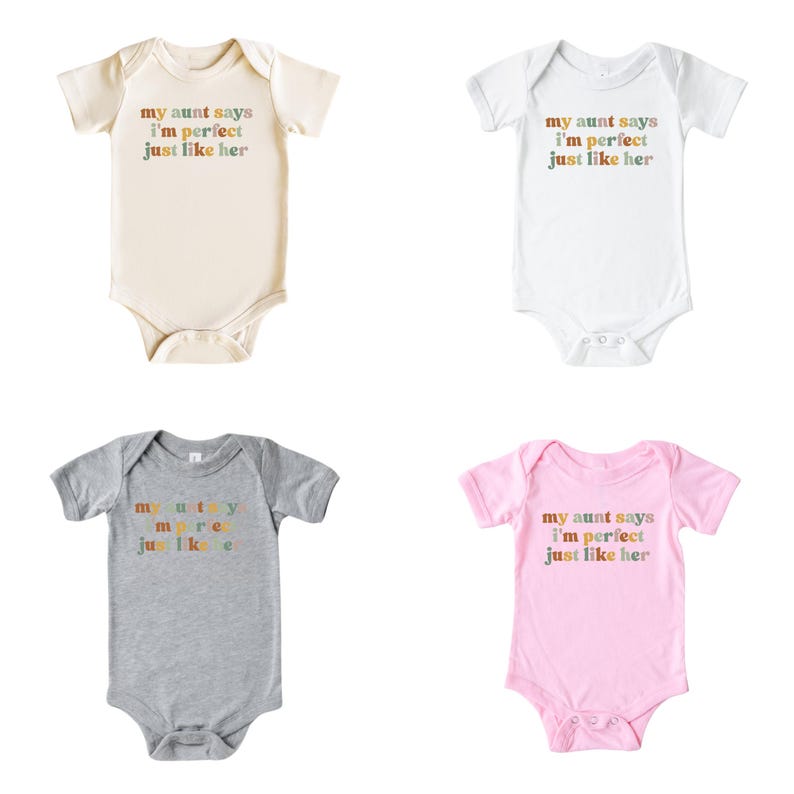 May include: Four baby onesies in different colors. The onesies have the text "my aunt says I'm perfect just like her" printed on them in rainbow colors.