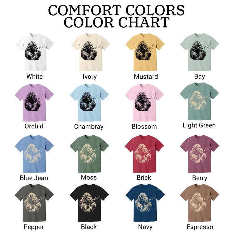 Puede incluir: Una carta de colores Comfort Colors con diecis&eacute;is camisetas de manga corta en varios colores, cada una con el gr&aacute;fico de una criatura soplando un diente de le&oacute;n. Los colores incluyen blanco, marfil, mostaza, bay, orqu&iacute;dea, chambray, flor, verde claro, azul jean, musgo, ladrillo, baya, pimienta, negro, marino y espresso.