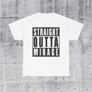 May include: White t-shirt with black text that reads "STRAIGHT OUTTA MIRAGE".