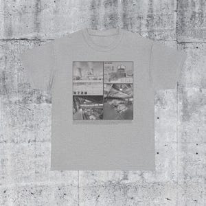 May include: A gray t-shirt with a black and white image of a nuclear power plant. The image is divided into four sections, each showing a different part of the plant. The text "Fukushima Daiichi" is printed in Japanese characters below the image.