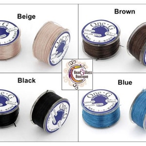 May include: Four spools of One-G nylon beading thread in beige, brown, black, and blue. Each spool is labeled "One-G" and "330dte NYLON 100%".