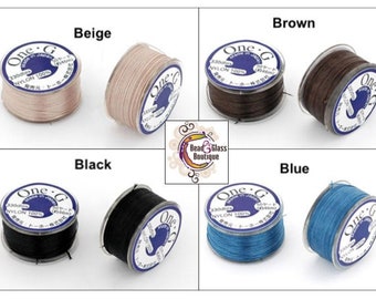 May include: Four spools of One-G nylon beading thread in beige, brown, black, and blue. Each spool is labeled "One-G" and "330dte NYLON 100%".