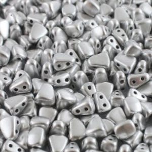 May include: A close-up shot of a pile of silver-colored beads. The beads have a unique shape with two holes, and a smooth, metallic finish. The beads are scattered, creating a textured surface.