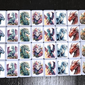 May include: A set of 24 white ceramic tiles with colorful dragon illustrations. Each tile features a different dragon design, including a floral dragon, a dragon with wings spread, and a dragon with its head turned to the side. The tiles are perfect for a variety of craft projects, such as mosaics, wall art, and jewelry making.