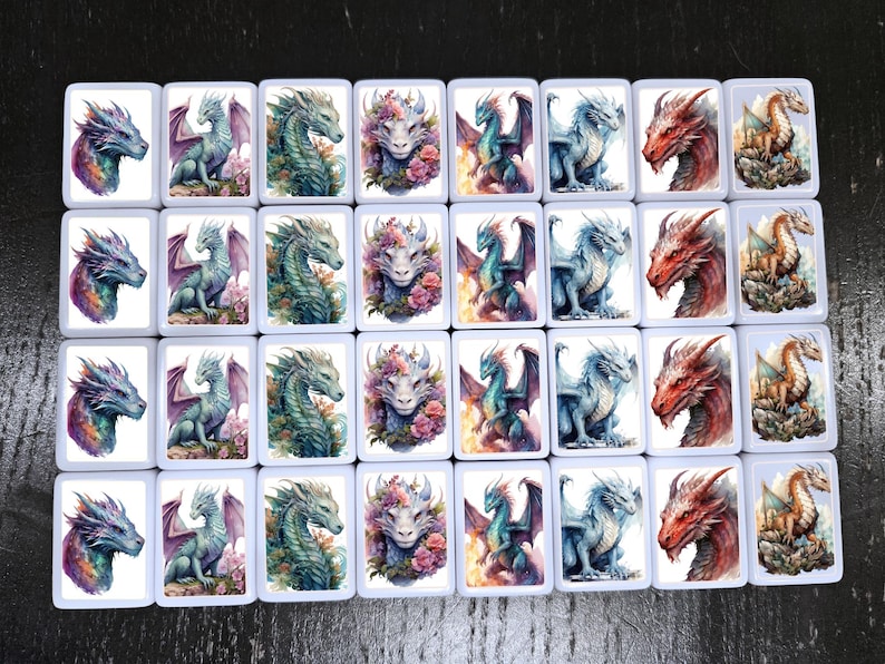 May include: A set of 24 white ceramic tiles with colorful dragon illustrations. Each tile features a different dragon design, including a floral dragon, a dragon with wings spread, and a dragon with its head turned to the side. The tiles are perfect for a variety of craft projects, such as mosaics, wall art, and jewelry making.