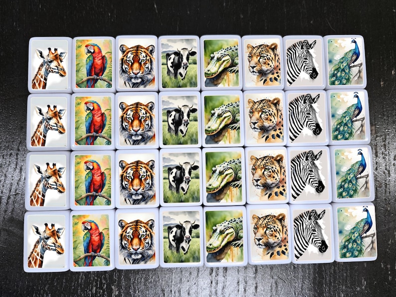 May include: A set of 36 white tiles with colorful animal illustrations. Each tile features a different animal, including a giraffe, a parrot, a tiger, a cow, an alligator, a leopard, a zebra, and a peacock.