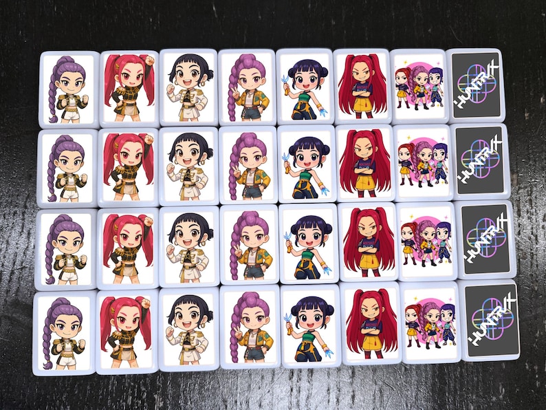 May include: A collection of rectangular cards featuring cartoon illustrations of anime-style characters with various hairstyles and outfits. Some cards display a group of characters, while others have the word "HUNTRA" with a colorful design.