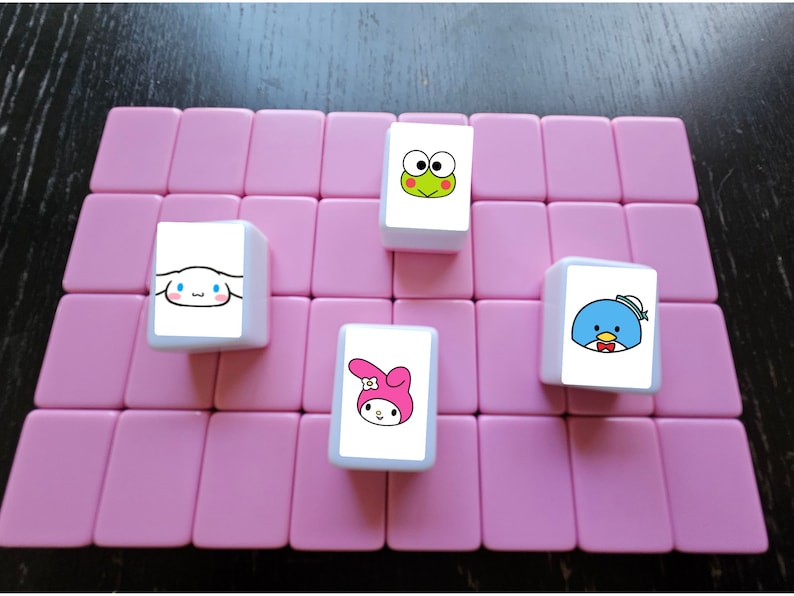 May include: Four white square tiles with cartoon characters on a pink background. The tiles feature a frog, a penguin, a bunny, and a dog.