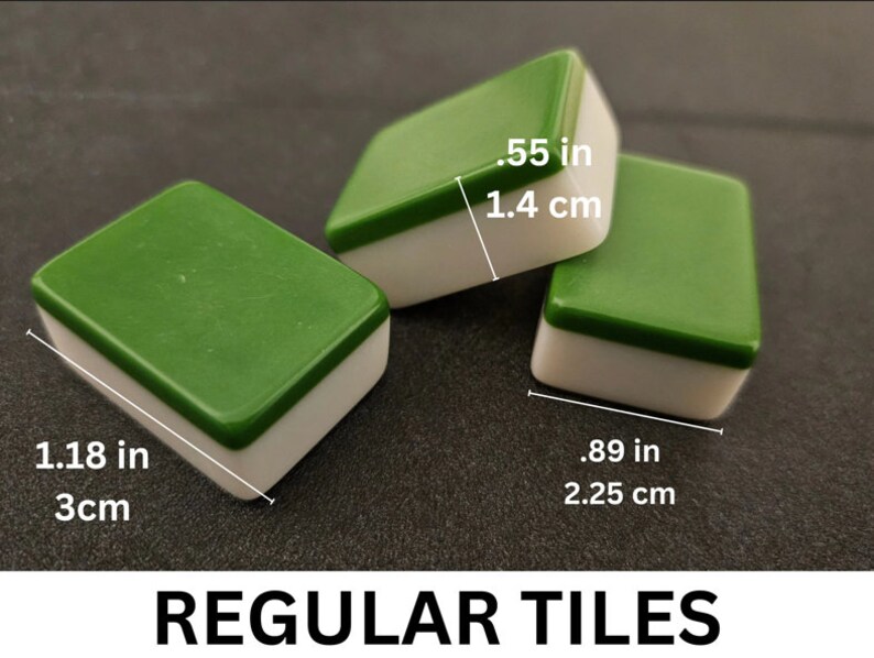 May include: Three green and white mahjong tiles. The tiles are 1.18 inches long and .89 inches wide. The tiles are 3 cm long and 2.25 cm wide.  REGULAR TILES