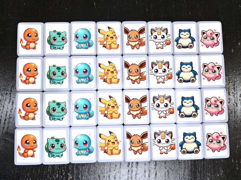May include: A set of 36 white square tiles with colorful cartoon images of Pokemon characters. The tiles are arranged in a 6x6 grid. Each tile features a different Pokemon character, including Pikachu, Charmander, Squirtle, Bulbasaur, and more.