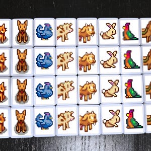 May include: A collection of white tiles featuring pixelated farm animals. The tiles display images of cats, dogs, chickens, cows, rabbits, parrots, and horses. The tiles are arranged in a grid pattern.