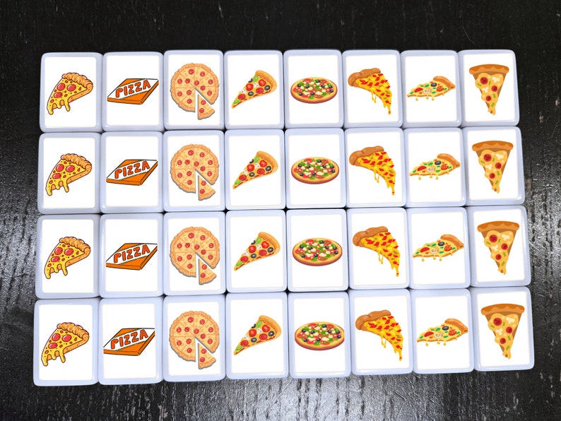 May include: A set of 36 white square tiles with images of pizza slices and whole pizzas. Each tile has the word "PIZZA" printed on it in orange letters.