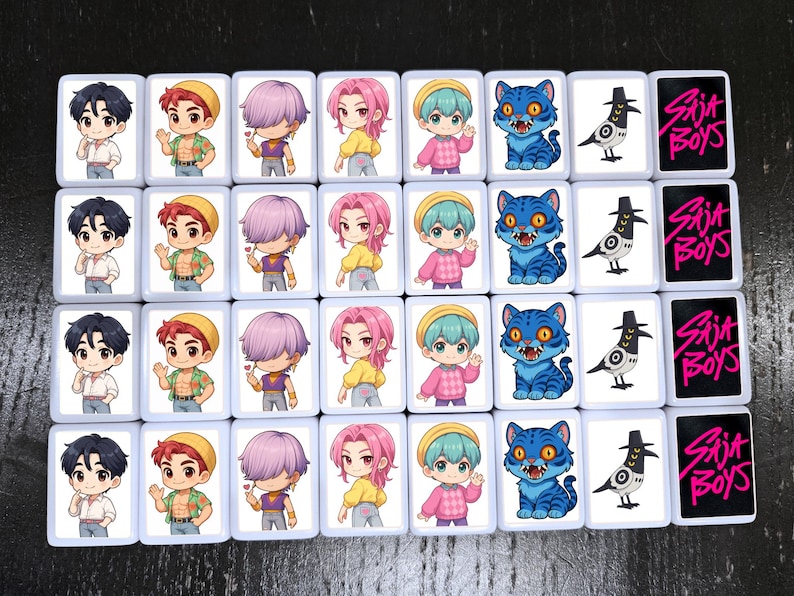 May include: A collection of rectangular tiles featuring cartoon illustrations. The tiles display various characters with different hair colors, a blue cat, a bird, and the text "Saja Boys" in pink.