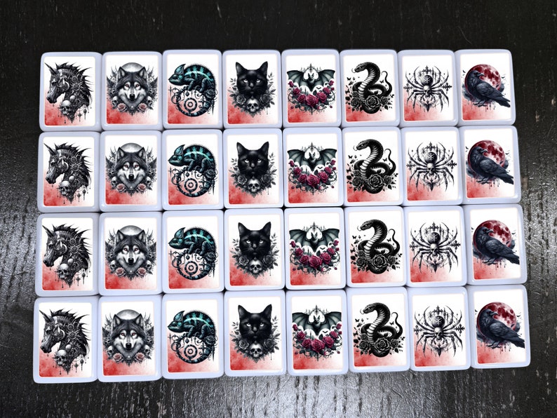 May include: Set of 16 white ceramic tiles with black and white illustrations of animals, insects, and plants. Each tile has a different design, including a wolf, a chameleon, a spider, a bat, a skull, and a rose.