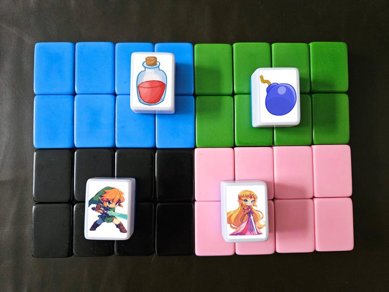 May include: Four white tiles with colorful cartoon images. The top left tile has a red potion bottle, the top right tile has a blue bomb, the bottom left tile has a green-clad character with orange hair holding a sword, and the bottom right tile has a blonde character in a pink dress.
