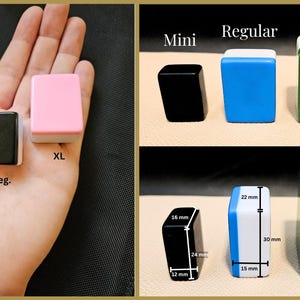 May include: Three different sizes of mahjong tiles: mini, regular, and extra large. The tiles are shown in a hand, with the mini tile being the smallest and the extra large tile being the largest. The tiles are all made of plastic and have a white border. The mini tile is pink, the regular tile is black, and the extra large tile is green.