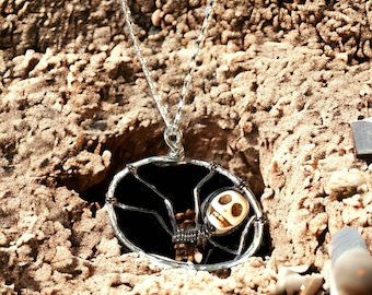 skeleton in hole necklace