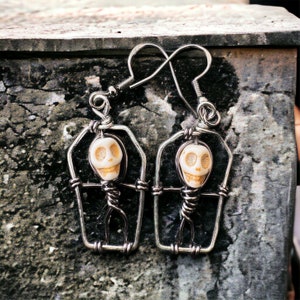 skeleton in coffin earrings image 1