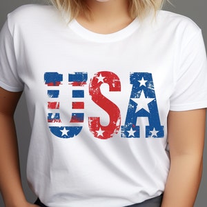 May include: White t-shirt with a distressed red, white, and blue "USA" graphic.