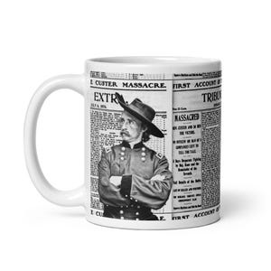 May include: White ceramic mug featuring a black and white image of a historical figure in a military uniform, with text from a newspaper article. The mug has a white handle and a glossy finish.