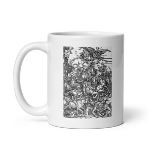 May include: White ceramic mug with a black and white illustration of a scene from the Four Horsemen of the Apocalypse, a woodcut by Albrecht Dürer.