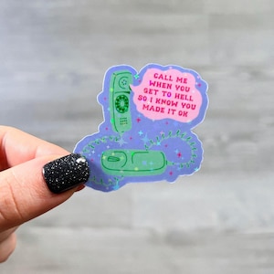 May include: A sticker with a purple background and a green phone with a pink speech bubble that says "Call me when you get to hell so I know you made it ok."