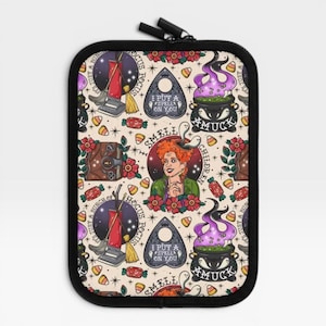 May include: A rectangular zippered pouch featuring a cream-colored background with a repeating pattern of Hocus Pocus themed illustrations, including a red vacuum, a spirit board, a bubbling cauldron, a spellbook, and a central portrait of Winifred.