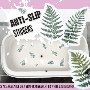 Peut inclure: Autocollants antidérapants avec des motifs de feuilles de fougère vertes. Les autocollants sont dispersés sur une baignoire blanche. Le texte "ANTI-SLIP STICKERS" est affiché dans un graphique en forme d'éclaboussure blanche. Disponibles sur fond semi-transparent ou blanc.