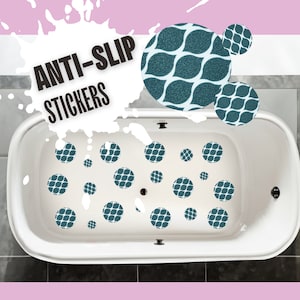 May include: White bathtub with blue and white patterned anti-slip stickers on the bottom. The text "ANTI-SLIP STICKERS" is visible in the image.