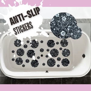 May include: White bathtub with black and white floral anti-slip stickers on the bottom. The text "ANTI-SLIP STICKERS" is written in black on a white background.