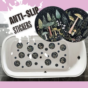 May include: White bathtub with black and white mushroom-themed anti-slip stickers. The stickers feature a dark background with colorful mushrooms and foliage.