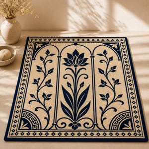 May include: A rectangular beige rug with a navy blue border and a central floral design. The rug features a navy blue lotus flower and stylized vines within arched frames. The border has geometric patterns.