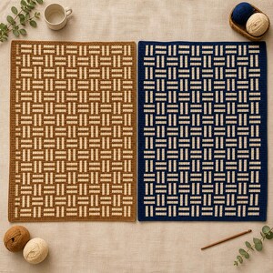 May include: Two rectangular crochet mats with a geometric pattern. One mat is brown and beige, the other is navy blue and beige. The mats are surrounded by yarn balls, a crochet hook, and a mug.