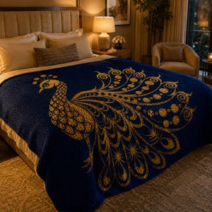 May include: A navy blue bedspread with a large gold peacock design. The peacock is intricately detailed with a textured appearance. The bedspread is draped over a bed with pillows and a headboard, creating a luxurious bedroom setting.