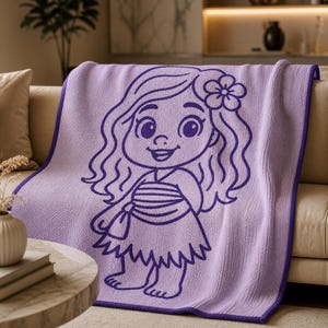 May include: A lavender throw blanket featuring a cartoon illustration of a girl with long wavy hair and a flower in her hair. The blanket has a purple border and is draped over a beige sofa. The illustration is in a darker shade of purple.