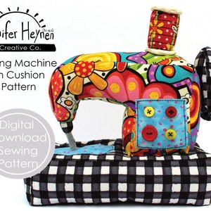 May include: A colourful sewing machine pin cushion pattern. The pattern features a bright, whimsical design with a black and white checkered base.