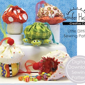 May include: A digital download sewing pattern for making small fabric pouches. The pattern is called "Little Ditties Sewing Pattern" and features four different pouch designs: a mushroom, a turtle, a cupcake, and a simple pouch. The pouches are made from colorful fabrics and are perfect for holding small items like jewelry, coins, or sewing supplies.