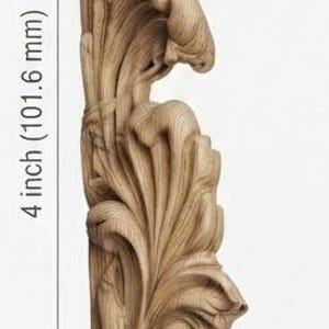 May include: A light brown wooden carving featuring an intricate acanthus leaf design. The piece measures 4 inches in height and 1 1/4 inches in width, as indicated by the measurement lines and text printed on the image.