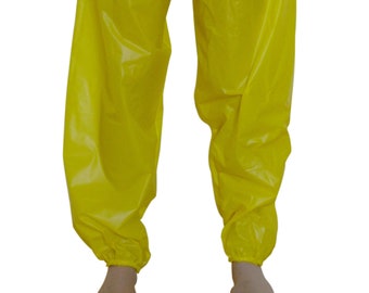 May include: A pair of bright yellow, shiny, elastic-waist pants. The pants are made of a smooth, water-resistant material.