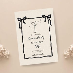 May include: A cream-colored invitation card with a black ribbon border and bow accents. The card features a martini glass illustration and the text "You're invited to a Dinner Party" with a date and address. The words "Let's celebrate!" are at the bottom.