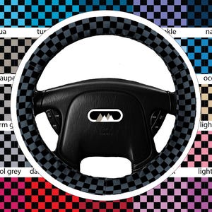 May include: Black steering wheel with a checkered gray and black cover. The background features a color chart with various checkered patterns in colors like aqua, light pink, and navy. The steering wheel has a white logo.